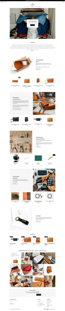 Screenshot of a leather goods website with a clean web design showcasing bags, purses, accessories and handmade items, plus product descriptions, workshops, customer reviews and navigation menus - all on a clean white background.